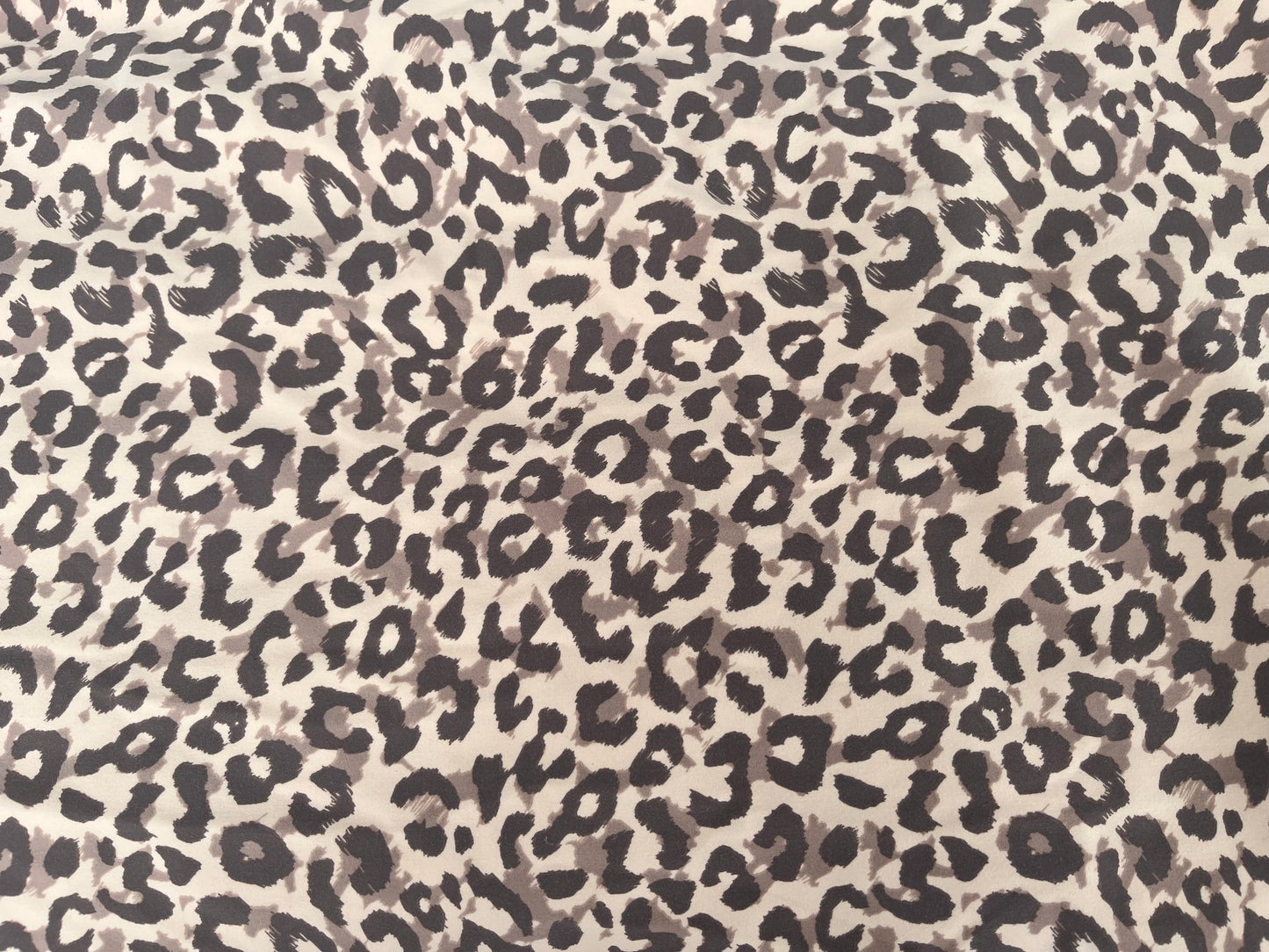 Leopard print pattern on a beige background