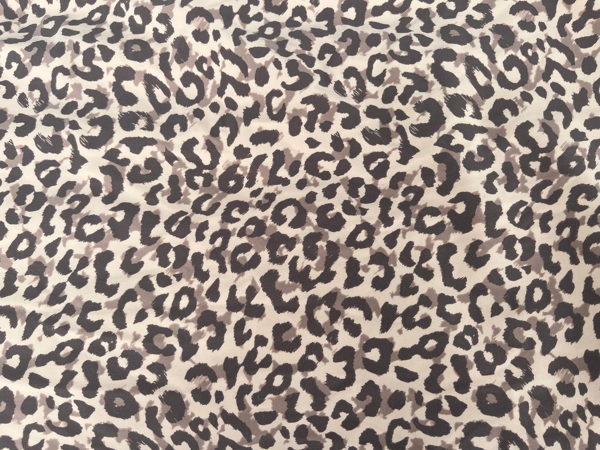 Leopard print pattern on a beige background