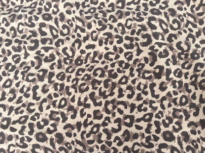 Leopard print pattern on a beige background